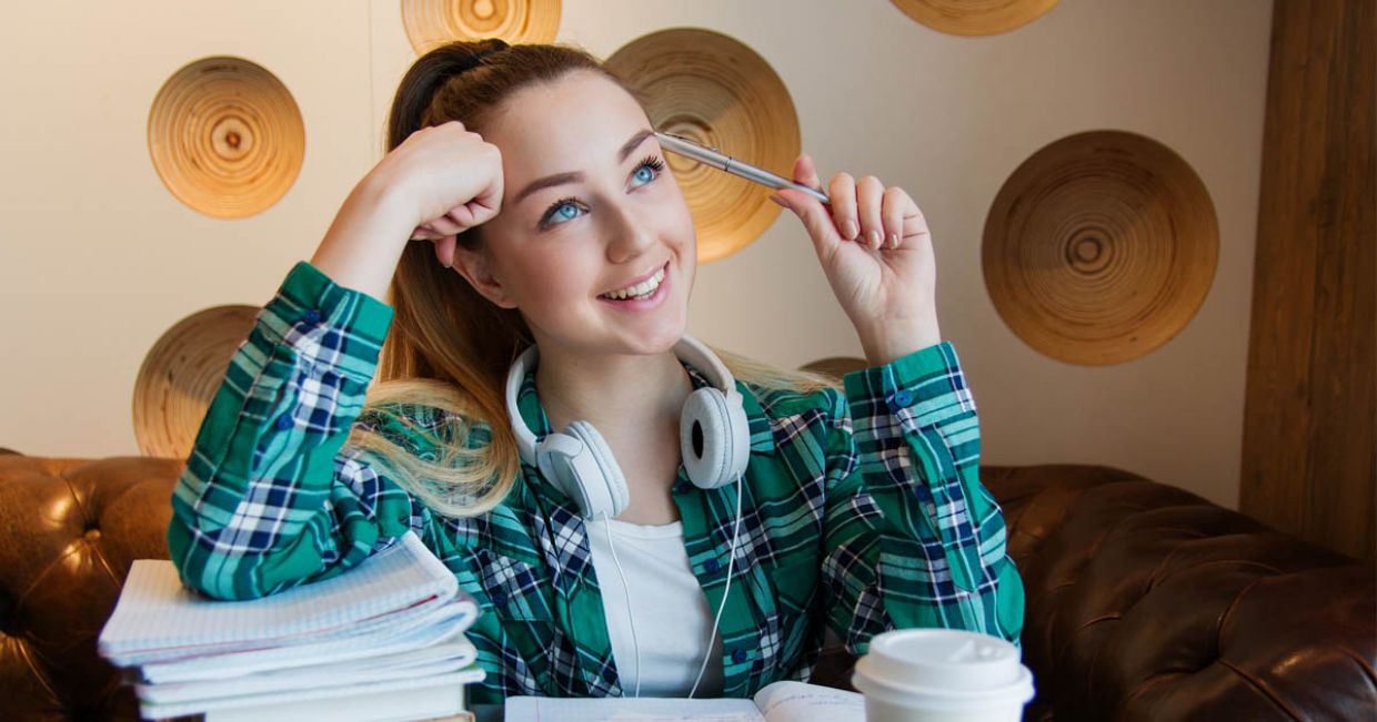 Girl at Student Beehive in University looking at FAQ's